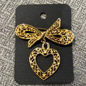 Gold dangle heart pin